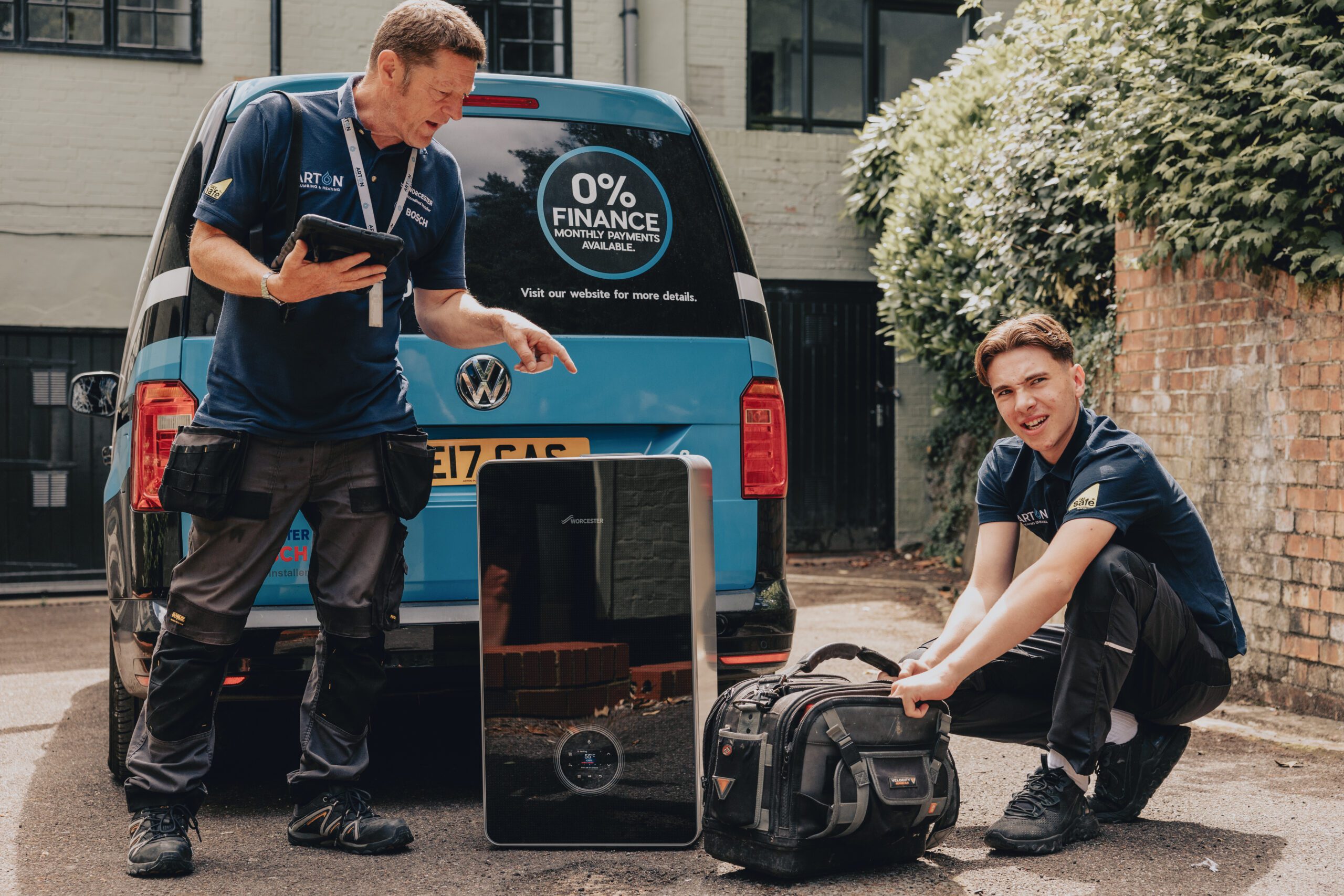 Arton Heating engineers with boiler equipment